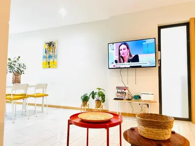 a living room with a tv on the wall at Sal Little Heart Sun NEW Apartment 5 in Santa Maria