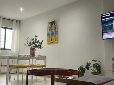 a living room with a table and chairs and a tv at Sal Little Heart Sun NEW Apartment 5 in Santa Maria