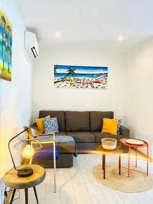 a living room with a couch and two tables at Sal Little Heart Sun NEW Apartment 5 in Santa Maria