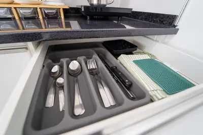 a drawer in a kitchen with utensils in it at GREEN STUDIO TARRAFAL - Ap 03 in Tarrafal