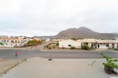 an empty street in a small town with a mountain at GREEN STUDIO TARRAFAL - Ap 03 in Tarrafal