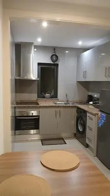 a kitchen with a sink and a dishwasher at Clara's Place - Morabeza Suite in Praia