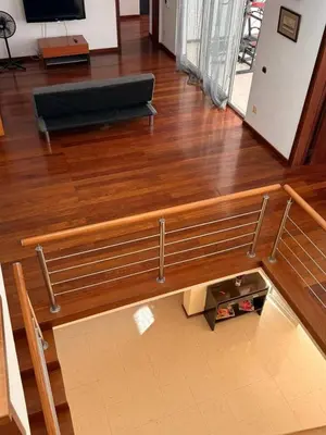 a living room with a couch on a wooden floor at Murdeira Villa with Private Pool V164 by RPG Group in Beirona