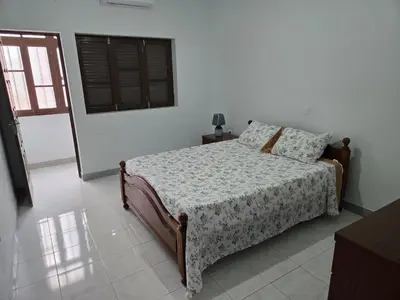 a bedroom with a bed and a window at Cozy 3 Bdr at Praia Da Laginha in Mindelo