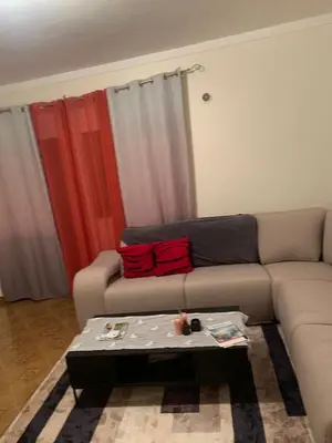 a living room with a couch and a coffee table at Maison Praia - Cap Vert in São Filipe