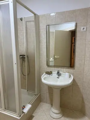a bathroom with a sink and a shower at Murdeira V162 A by RPG Group in Beirona