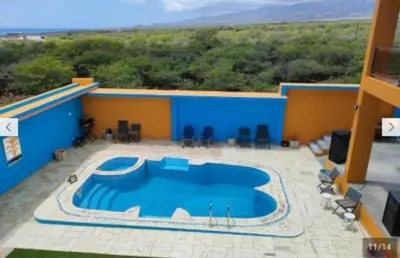 a large swimming pool on top of a building at Residencial oliveira in Porto Novo