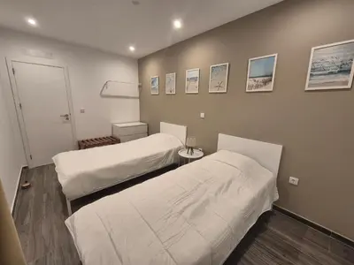 a room with two beds in a room at Casa Morada in Mindelo