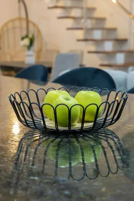 a bowl of green apples on a table at Marel Bliss Apartments T3 - Isabel in Mindelo