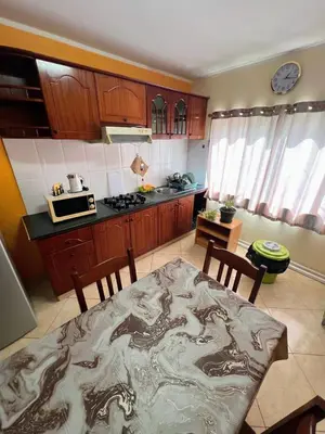 a kitchen with a table with a dragon blanket on it at Tropical Breeze Holidays in Santa Maria