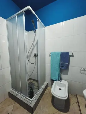 a bathroom with a shower and a toilet at Tropical Breeze Holidays in Santa Maria