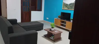 a living room with a couch and a tv at Edly aparatments in Mindelo