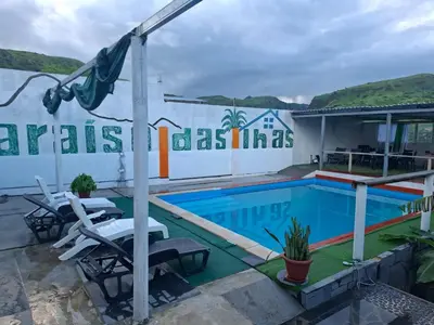 a villa with a swimming pool in a resort at Paraiso das ilhas in Ribeirão Chiqueiro