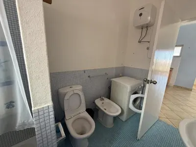 a bathroom with a toilet and a bidet at A Casa do Amor in Vila do Maio