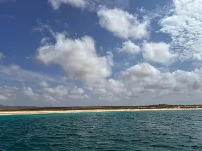 a body of water with a beach in the background at A Casa do Amor in Vila do Maio