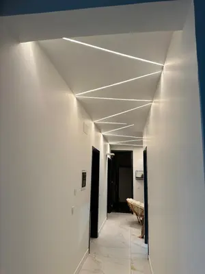 a hallway with white walls and a white ceiling at Belle maison Cosy et Moderne in Praia