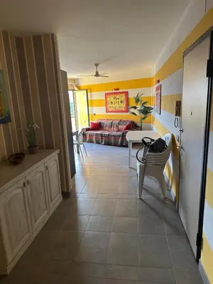 a living room with a couch and a table at Brisa Meridiana in Santa Maria