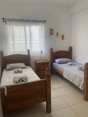 a bedroom with two beds and a window at My Boavista 3 in Sal Rei