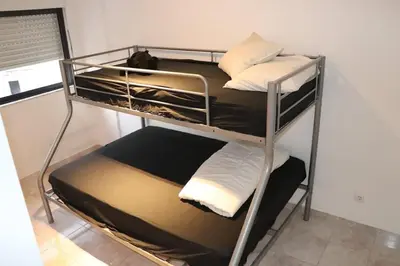 a couple of bunk beds in a room at Micaya in Praia