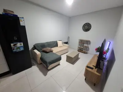 a living room with a couch and a table at One-bedroom apartment rental - Chã de Alecrim - SV in Mindelo