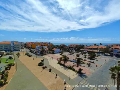 a view of a city with buildings and palm trees at Studio Apartment in the Center in Santa Maria