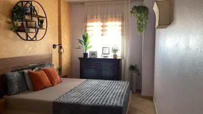 a bedroom with a bed and a window at Tropical Palma in Santa Maria