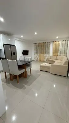 a living room with a couch and a table at Morabeza Home in Praia