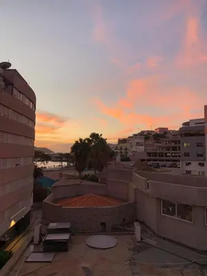 a view of a sunset from the roof of a building at Shay's House in Mindelo in Mindelo