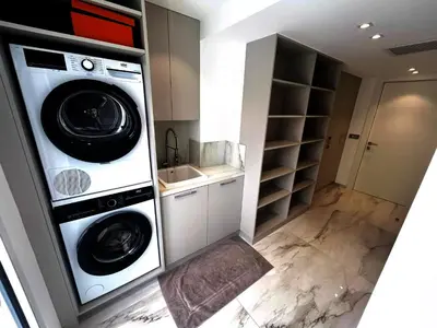 a kitchen with two washing machines and a sink at Sunshine Gold Spot in Santa Maria