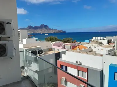 a view of the ocean from the balcony of a building at VISTA INVEST Apartamentos in Mindelo