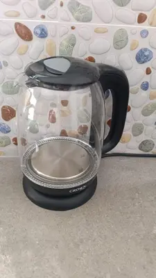 a glass coffee pot sitting on the floor next to a wall at Studio Sol e Sal in Santa Maria