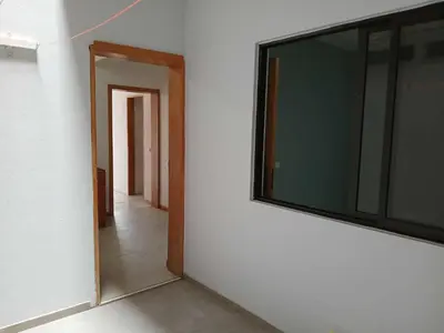 a room with a large window on the wall at O Meu Aconchego em Montsú in Prainha