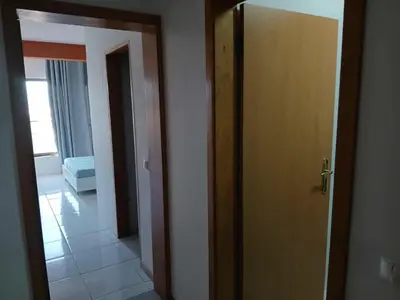 an open door to a room with a hallway at O Meu Aconchego em Montsú in Prainha