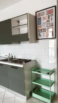 a kitchen with a sink and a stove at Verdes Anos - local accommodation in Santa Maria in Santa Maria