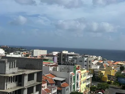 a view of a city with buildings and the ocean at Bestview of Palmarejo in Praia