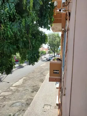 a building with a desk on the side of a street at Sol, Terra e Mar- No coração do Plateau in Praia