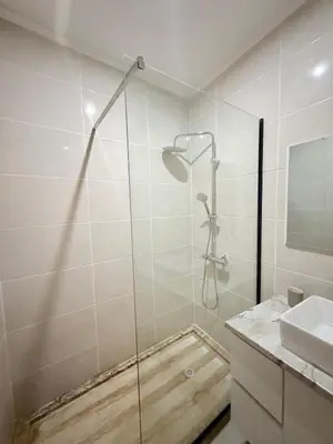 a bathroom with a shower and a sink at Spacious apartment in Praia Great for families in Montagarro