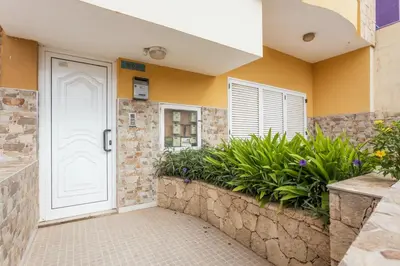a white door in a house with plants at Casa do Sal - AC, Free Wi-Fi, Near Beach in Santa Maria