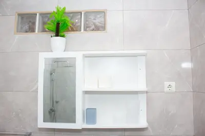 a bathroom with a glass shower with a potted plant at T2 City Center in Mindelo
