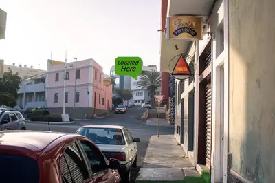 a street with cars parked on the side of the road at Studio Morna City Center in Mindelo
