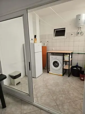 a kitchen with a washer and dryer in a room at Golden Flow in Espargos