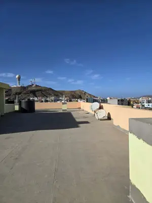a person sitting on the roof of a building at Golden Flow in Espargos