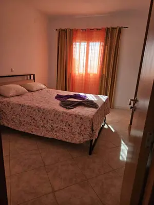 a bedroom with a bed and a window at Golden Flow in Espargos