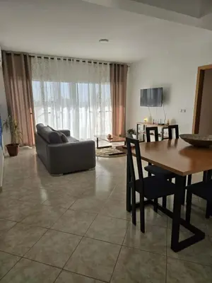 a living room with a couch and a table at Golden Flow in Espargos