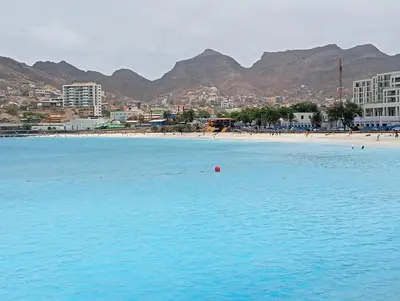a beach with a red ball in the water at Apt T2 -Laginha -On The Beach in Mindelo