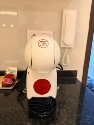a white mixer sitting on top of a counter at FreLux Urban Studio in Praia