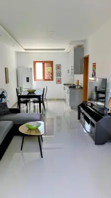 a living room with a couch and a table at Nos Kaza in Cidade Velha
