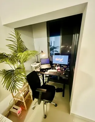 an office with a desk with a computer and a plant at Bright Modern Apart Mountain View, 5 Min to Beach in Praia