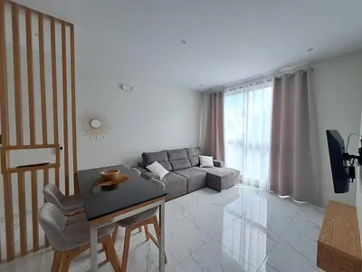 a living room with a couch and a table at Ocean Spirit Mindelo Apartment in Mindelo
