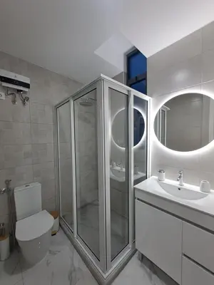 a bathroom with a shower and a toilet and a sink at Ocean Spirit Mindelo Apartment in Mindelo